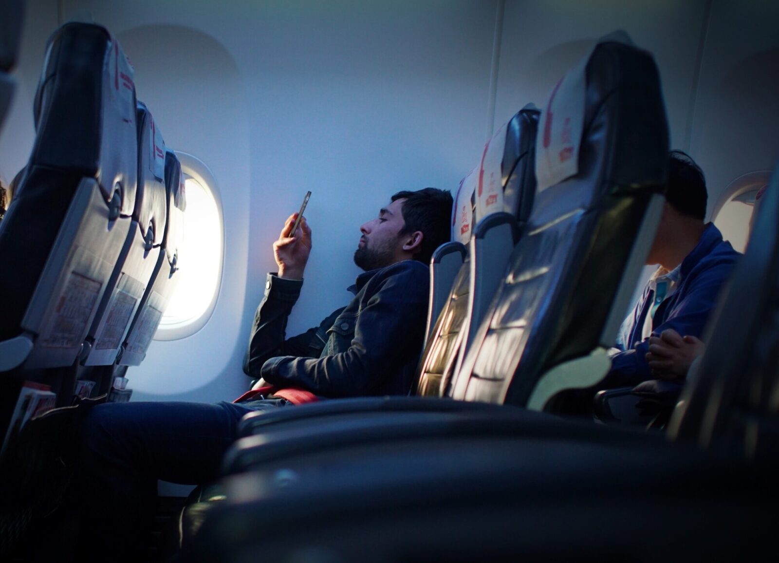 a man sitting on an airplane