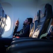 a man sitting on an airplane