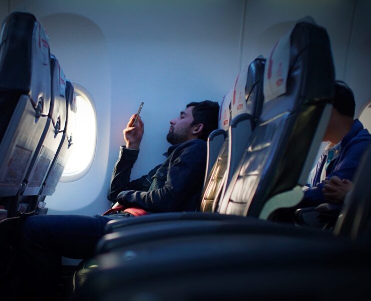 a man sitting on an airplane