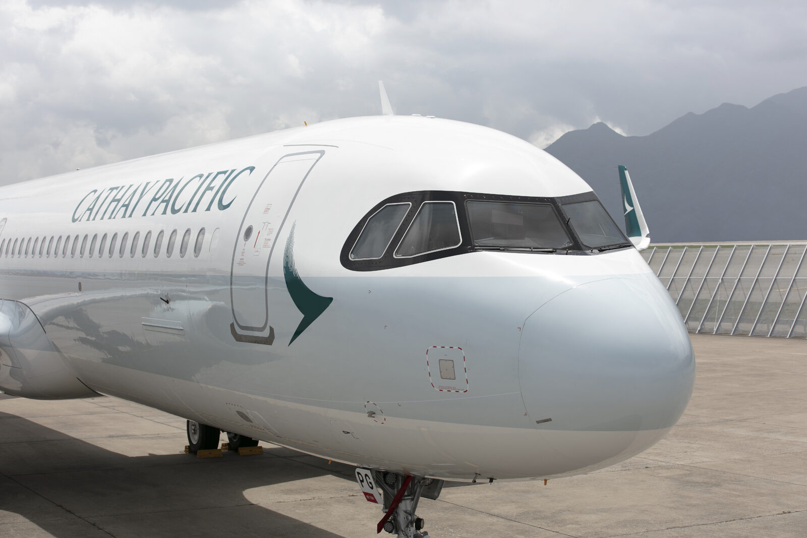 a white airplane on a runway