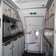 a white and grey interior of an airplane