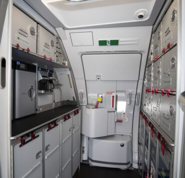 a white and grey interior of an airplane