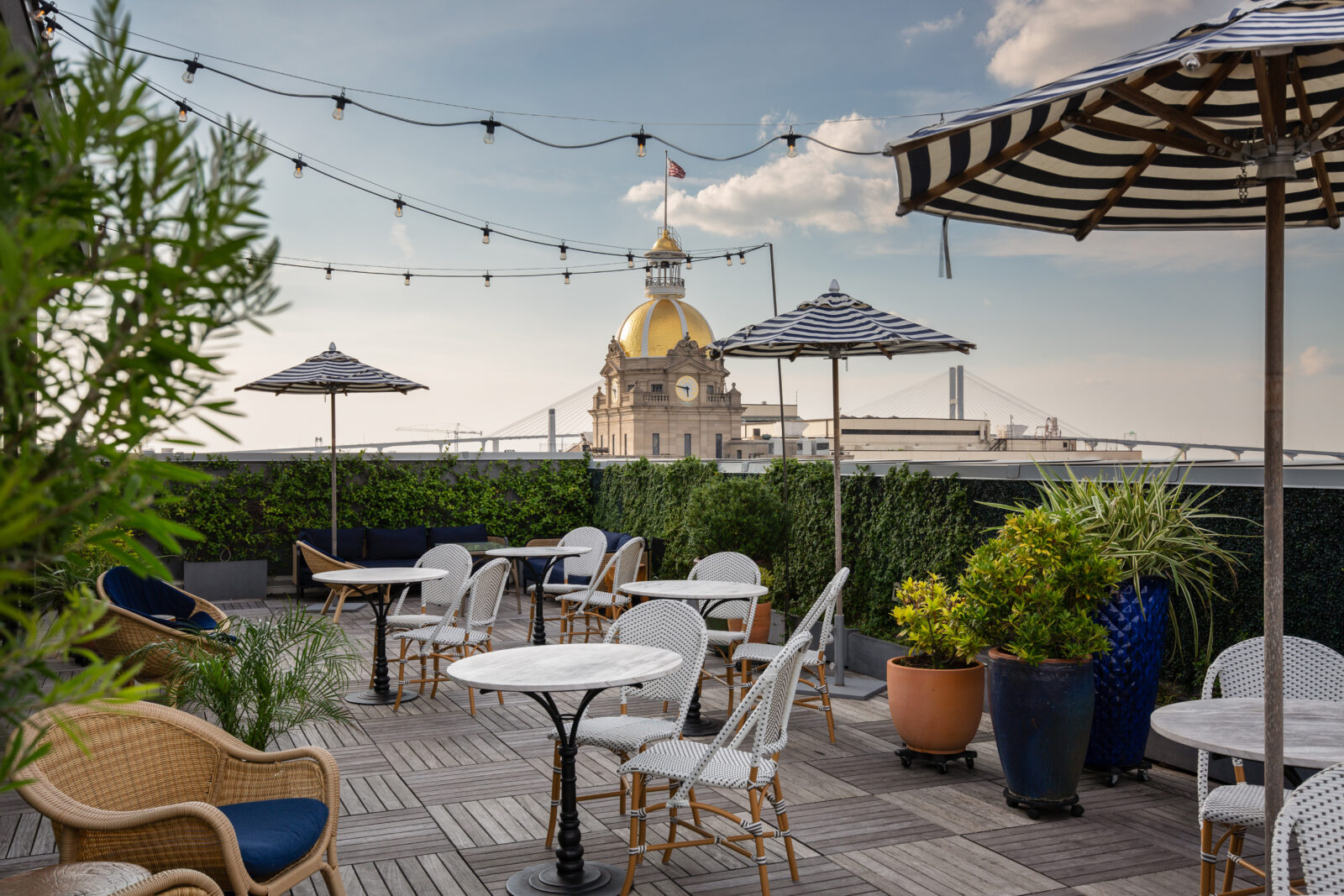 a patio with chairs and umbrellas