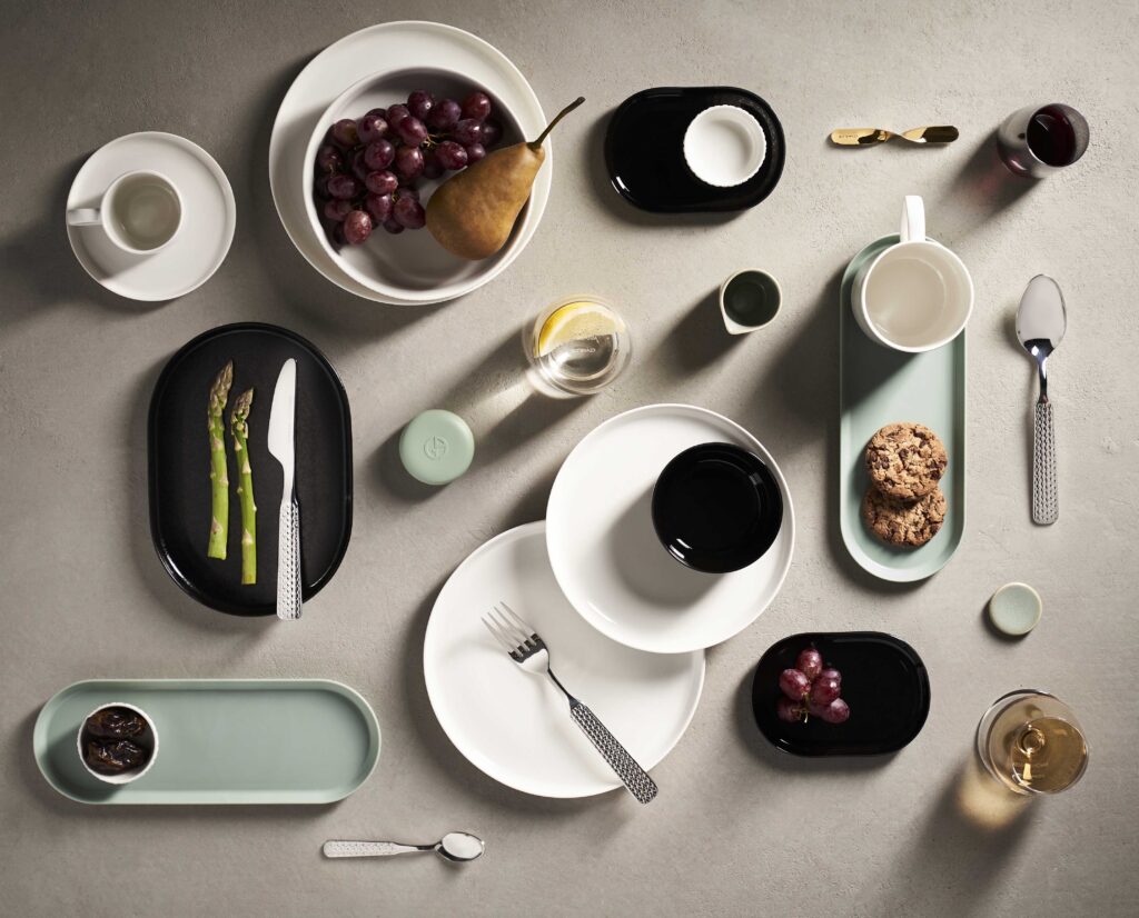 a table with plates and plates and utensils