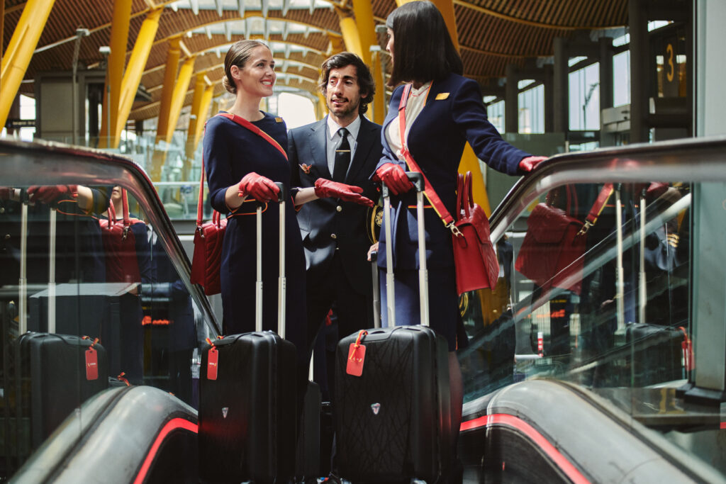 a group of people standing on an escalator