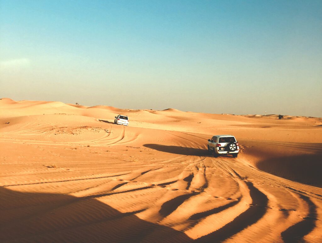 cars driving in the desert