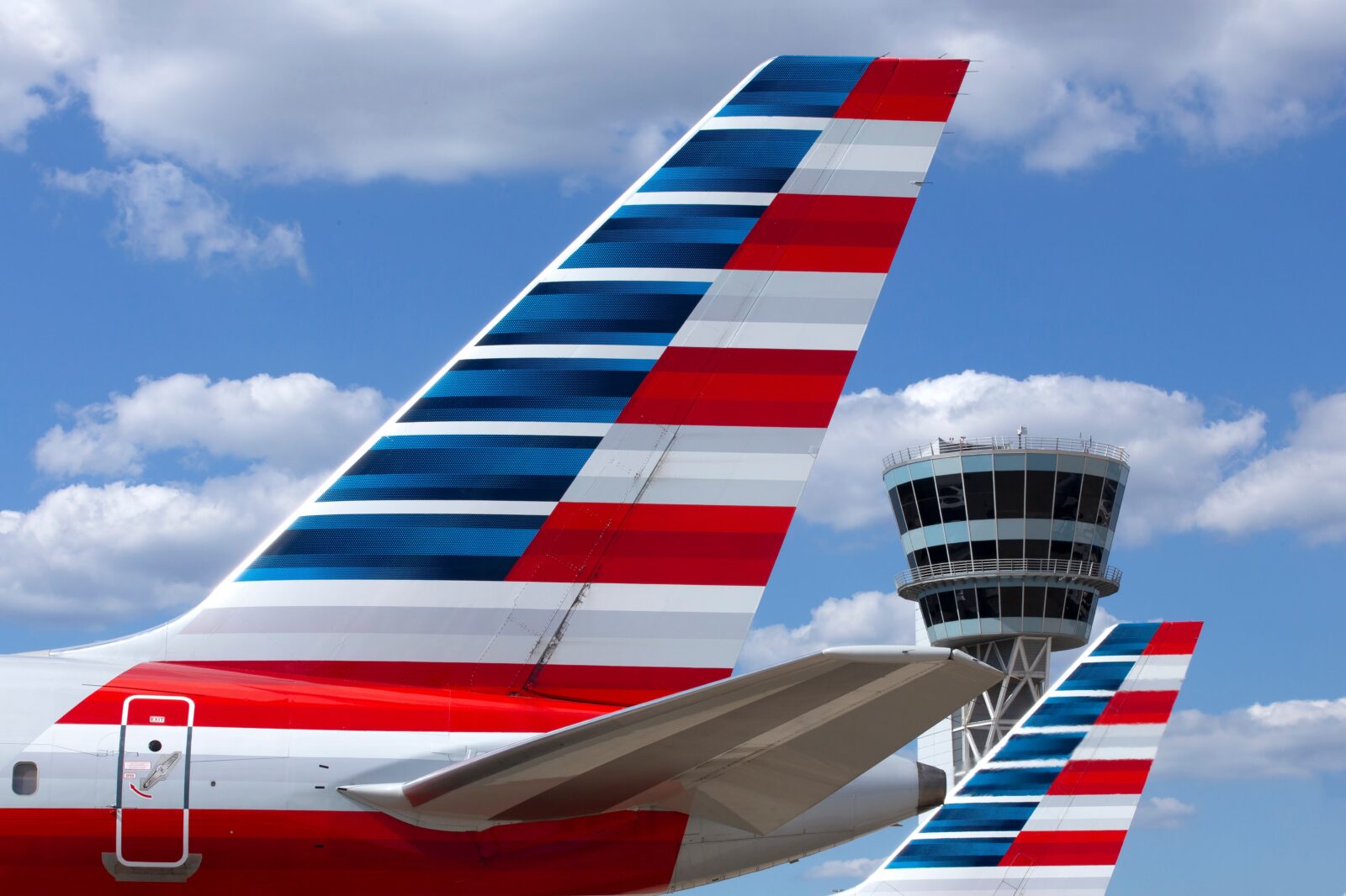 the tail of an airplane with stripes on it