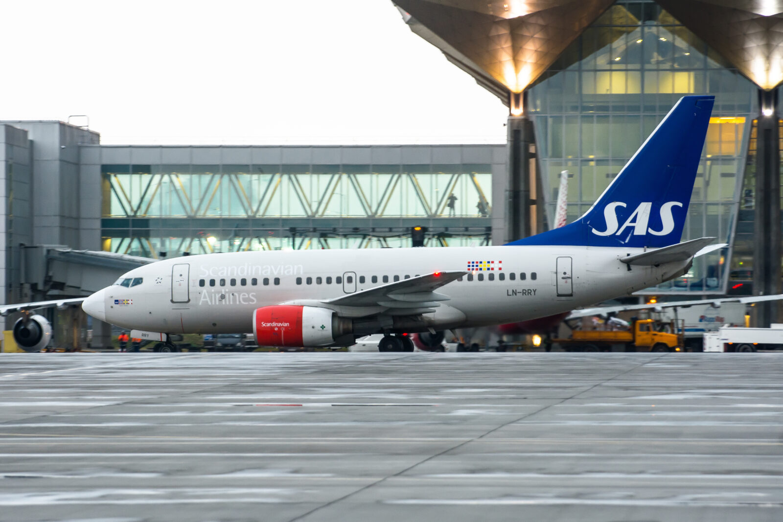 a white airplane on a runway