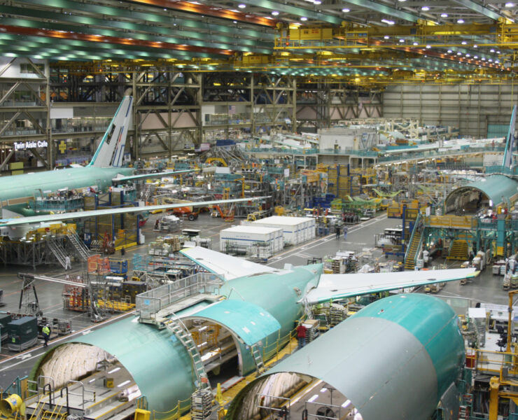 an airplane factory with many airplanes in it