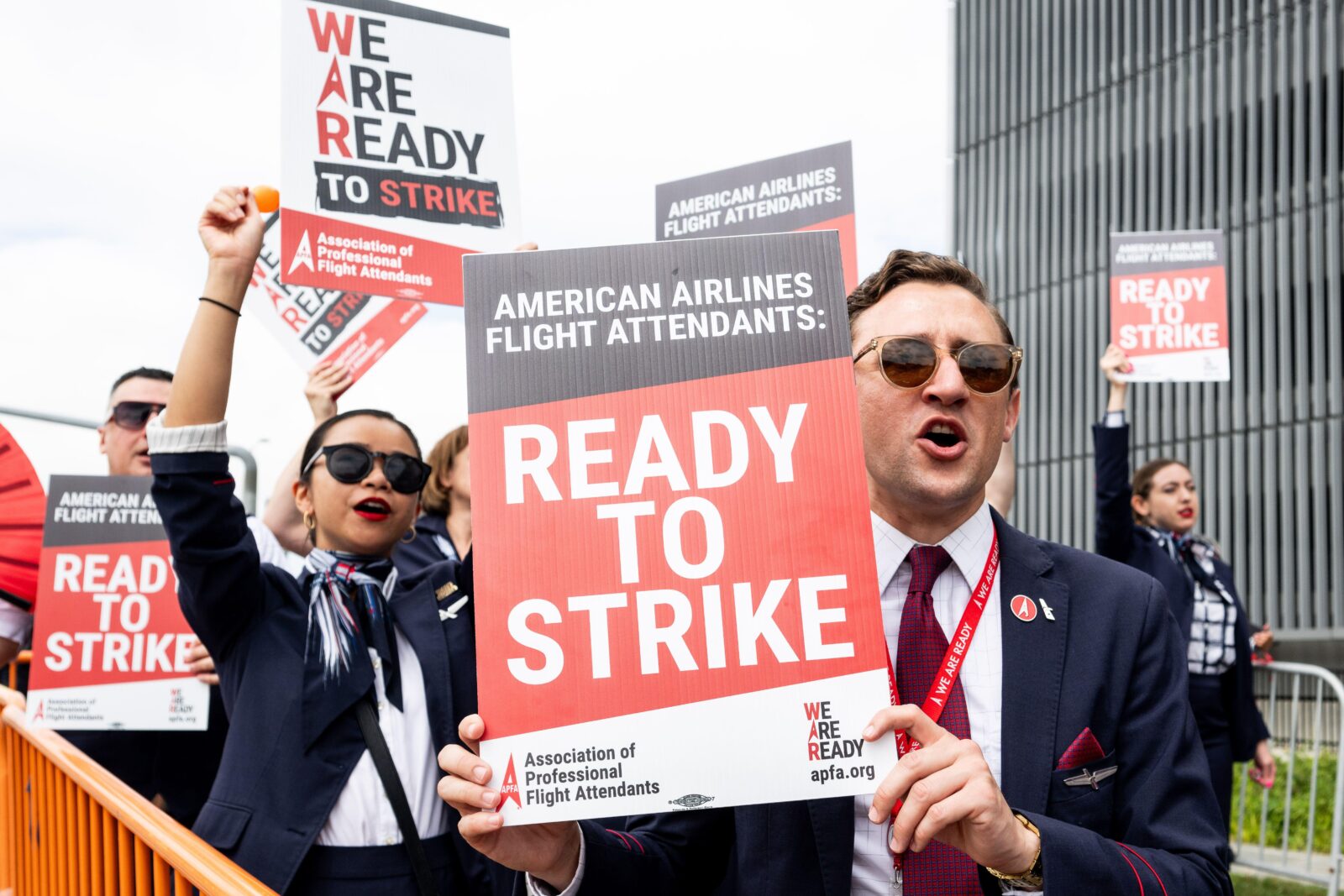 a group of people holding signs