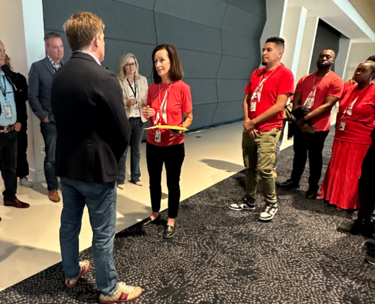 a group of people standing in a room