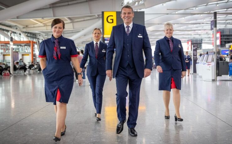 a group of people in uniform walking in a building