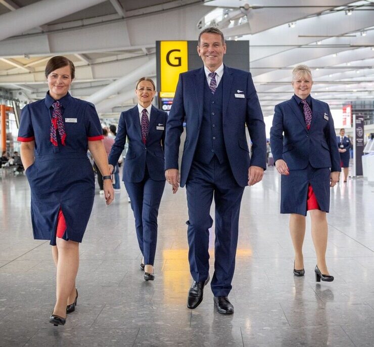 a group of people in uniform walking in a building
