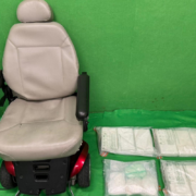 a chair next to bags of white substance