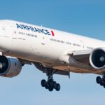 a white airplane in the air