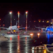 airplanes at an airport at night