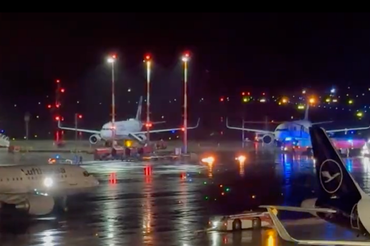 airplanes at an airport at night