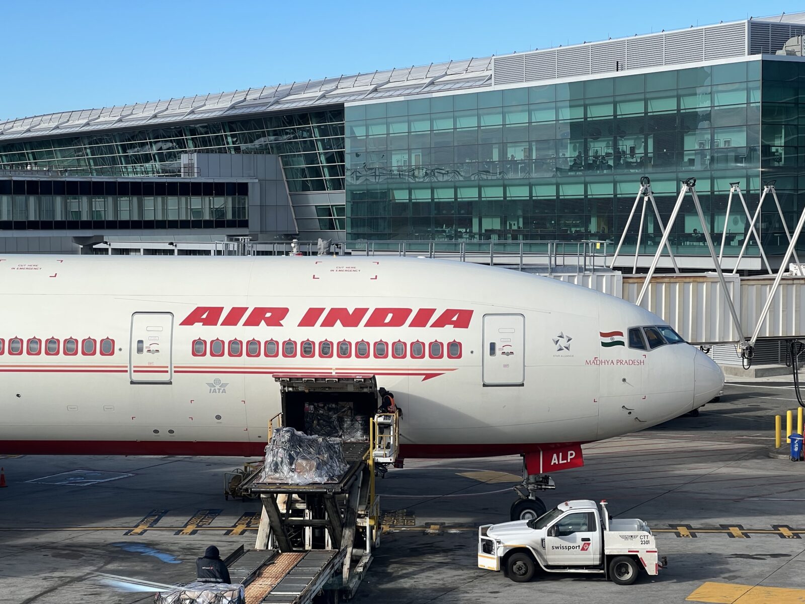 a white airplane with red writing on it