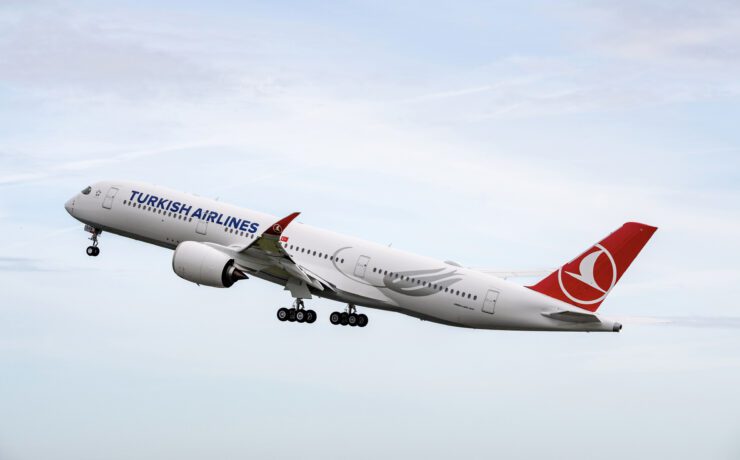 a large airplane flying in the sky