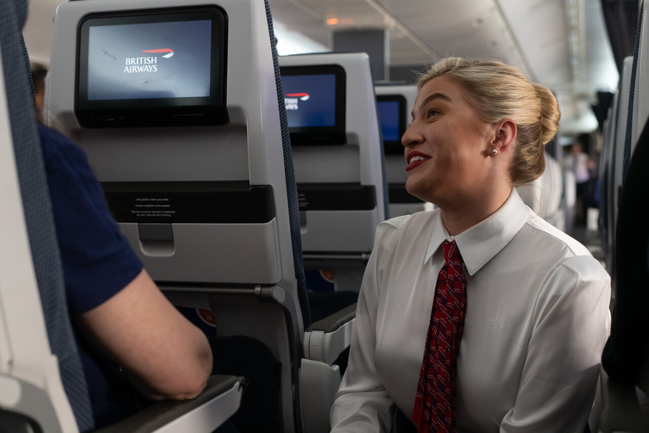 a woman sitting in an airplane