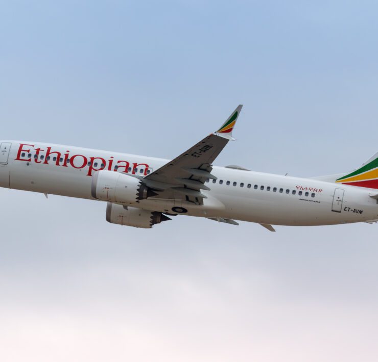 a white airplane flying in the sky