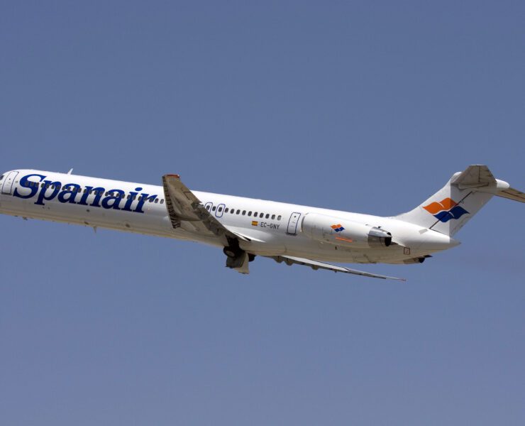 a white airplane flying in the sky