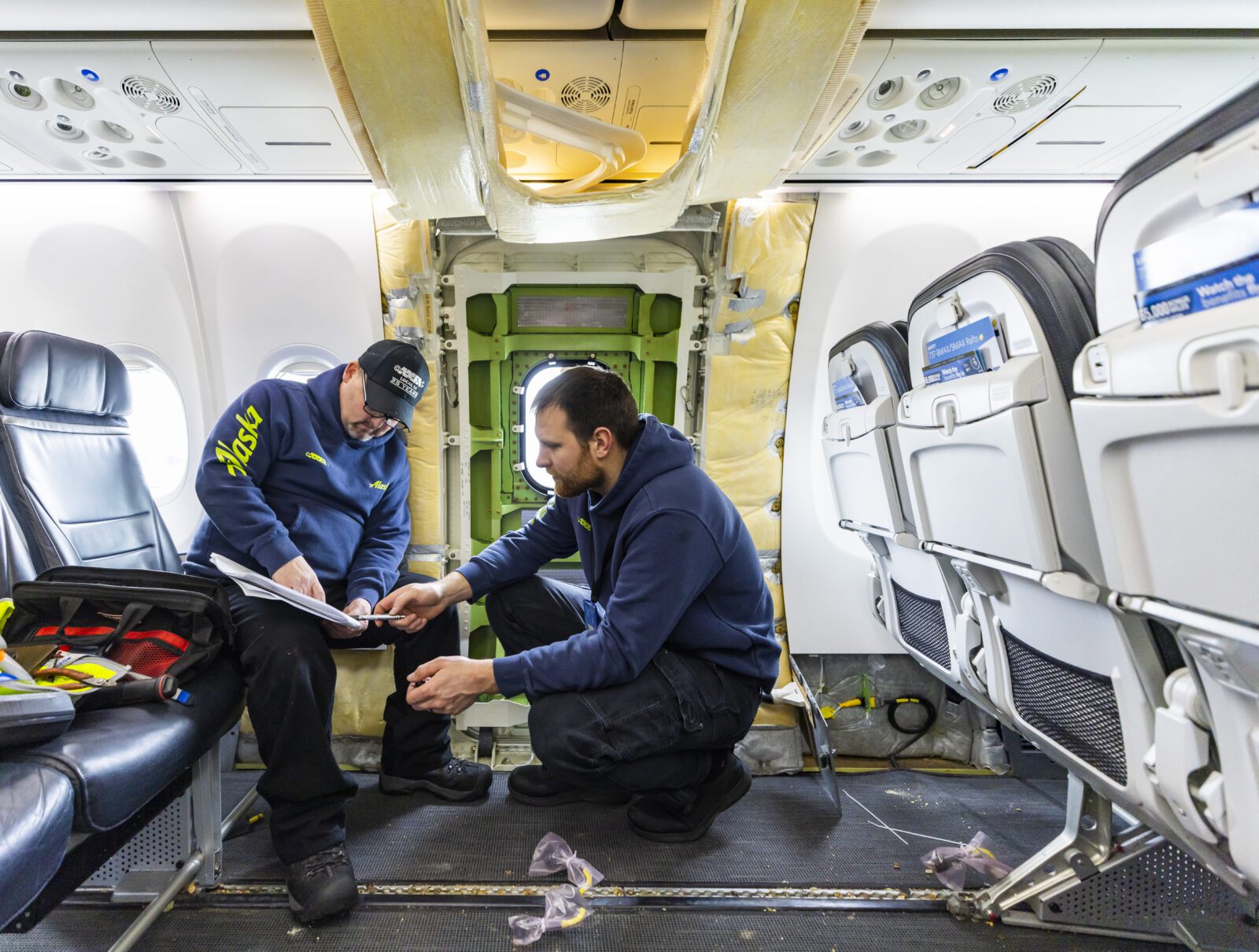 men sitting in an airplane