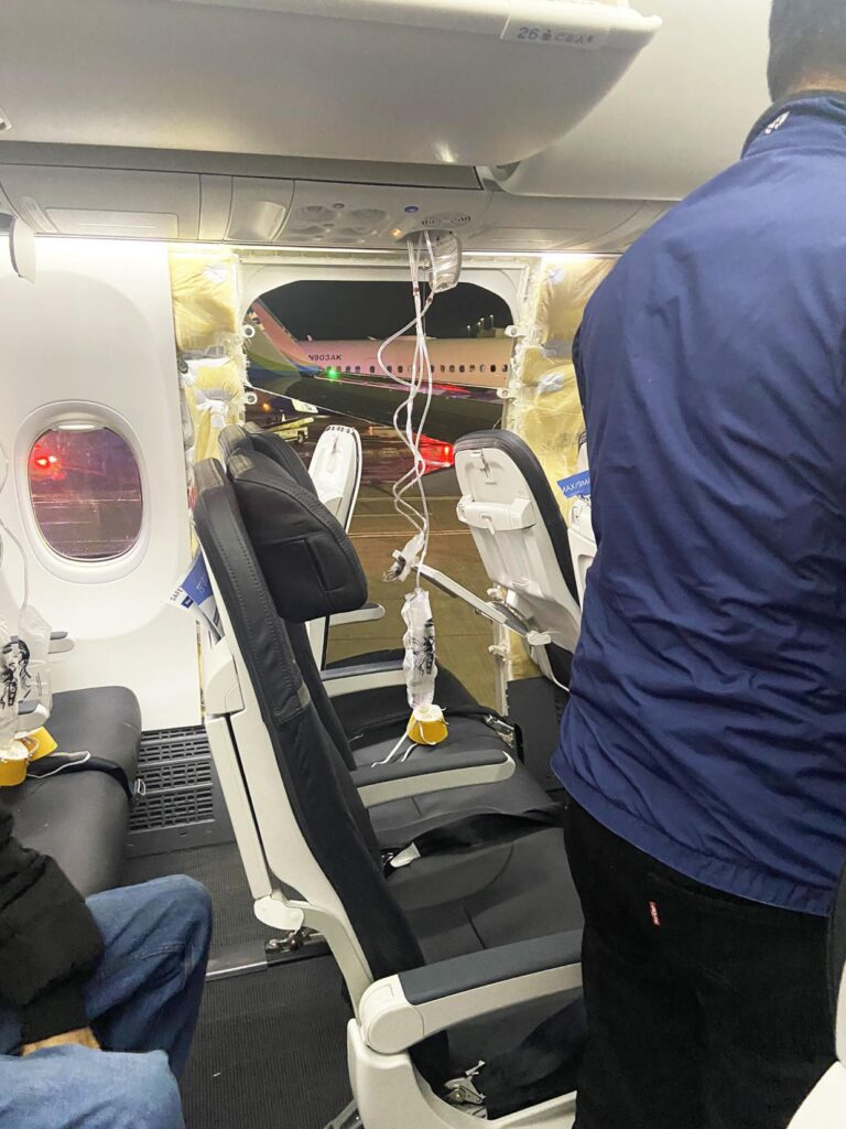 a person standing in the back of an airplane