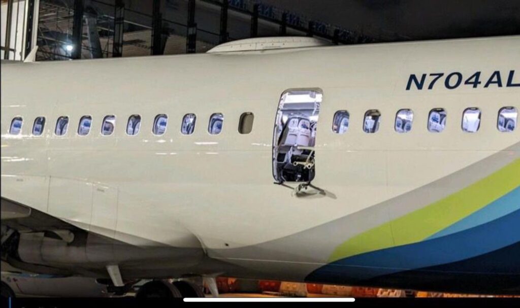 a white airplane with a door open