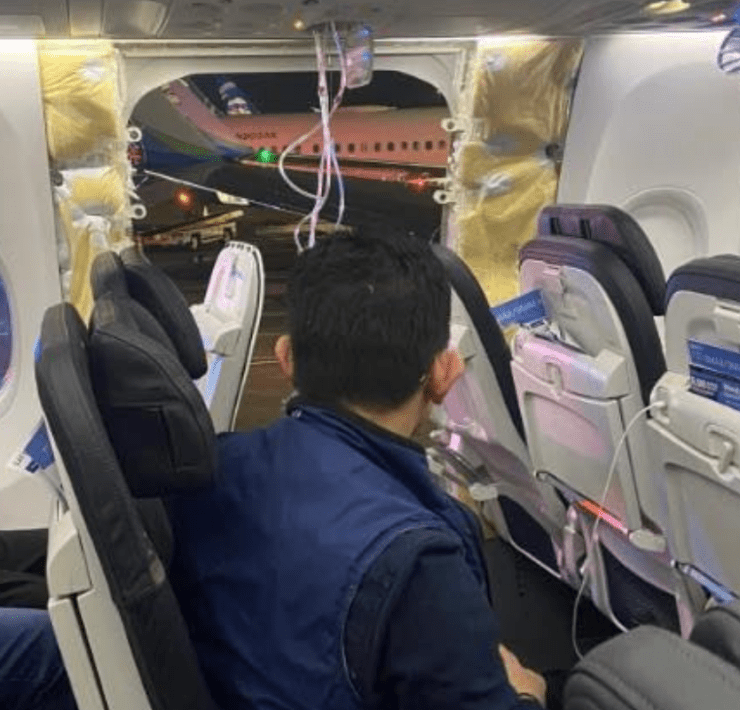 a man sitting in an airplane