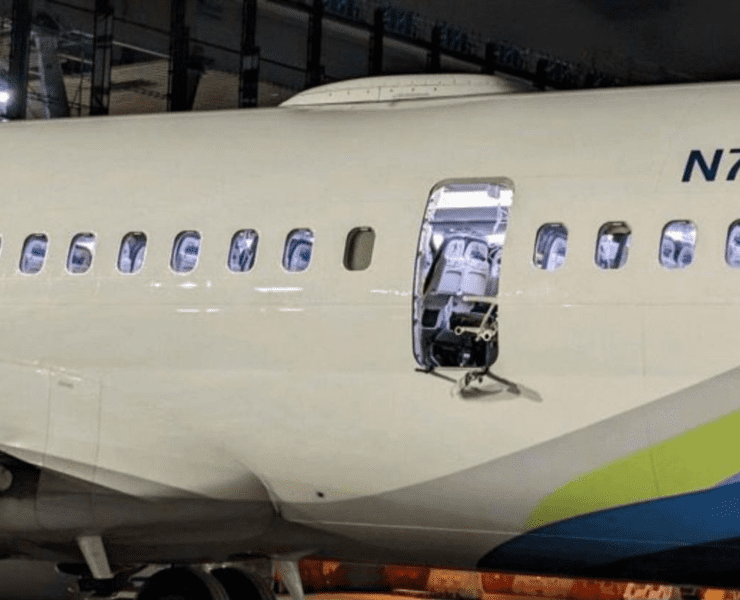 a white airplane with a door open