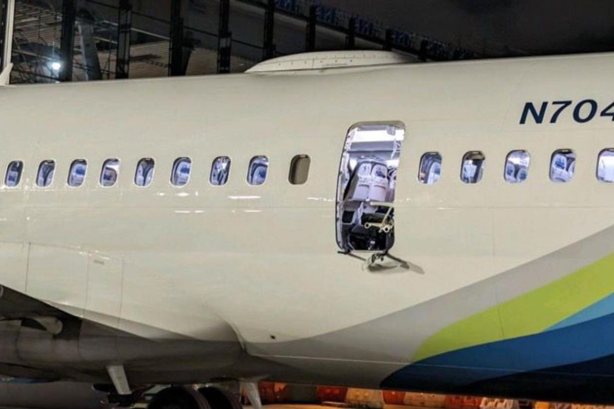 a white airplane with a door open