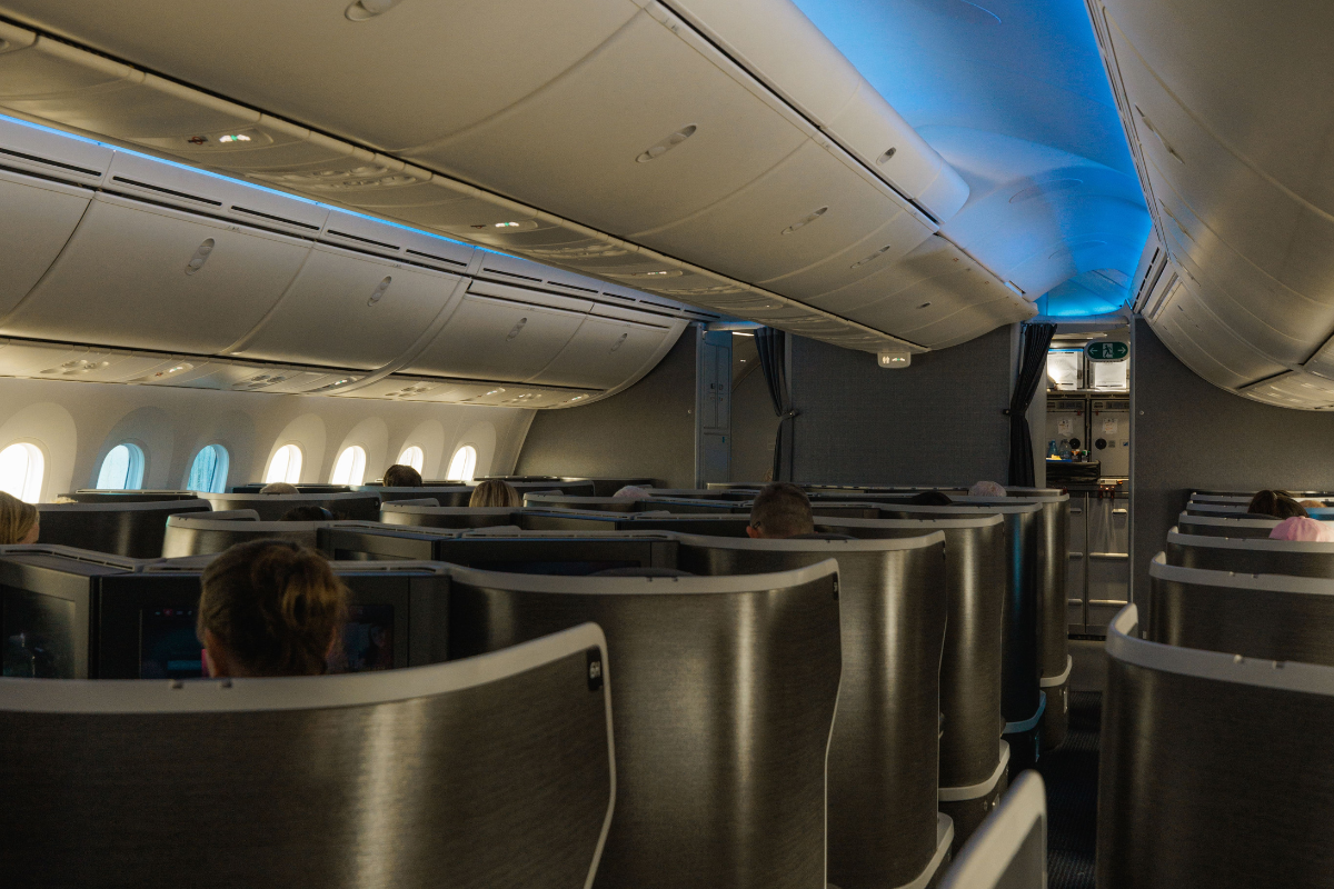 a group of people sitting in an airplane