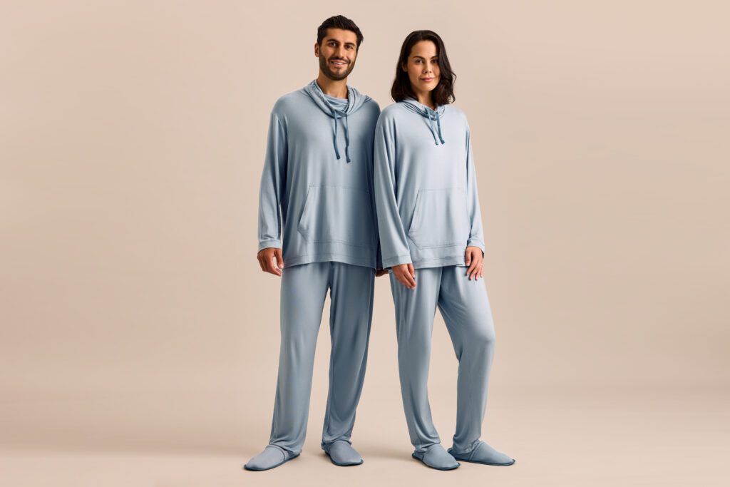 a man and woman wearing matching pajamas