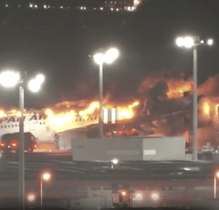 a plane on fire at night