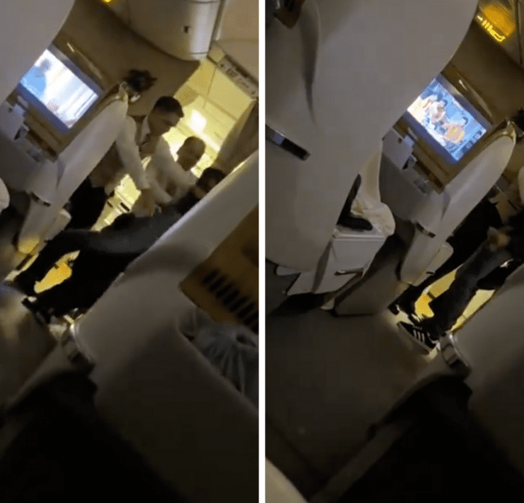 a man standing on the side of a plane