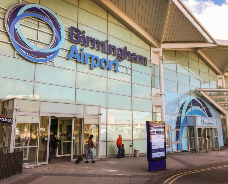 people walking in front of a building