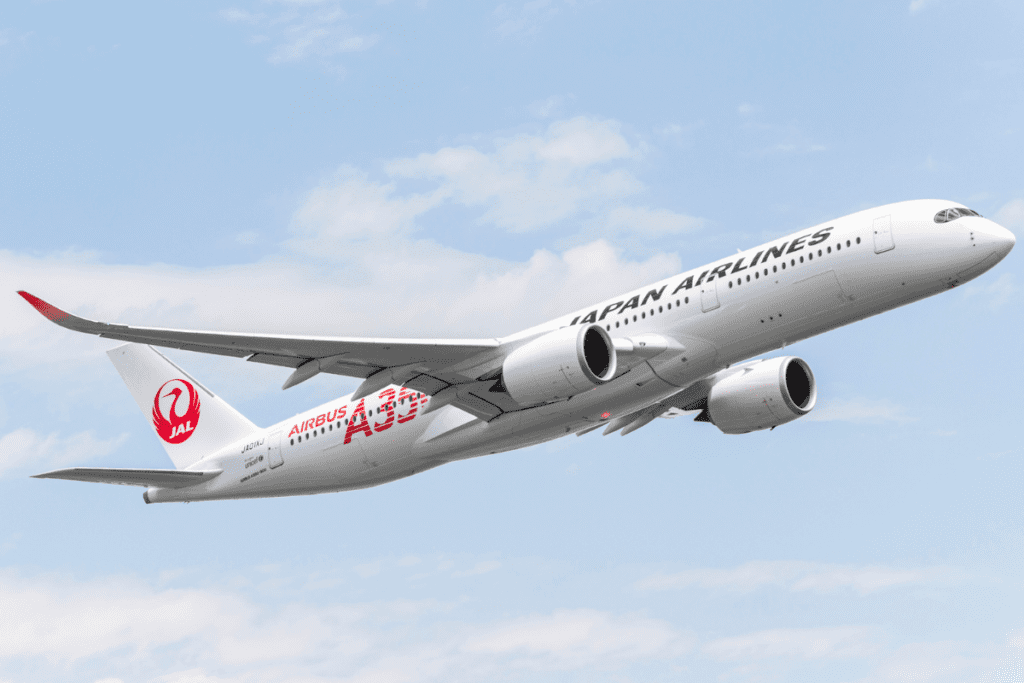 a white airplane in the sky