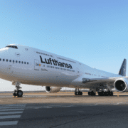 a large white airplane on a runway