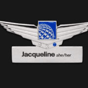 a silver badge with a blue square and a blue square with a blue square and black text