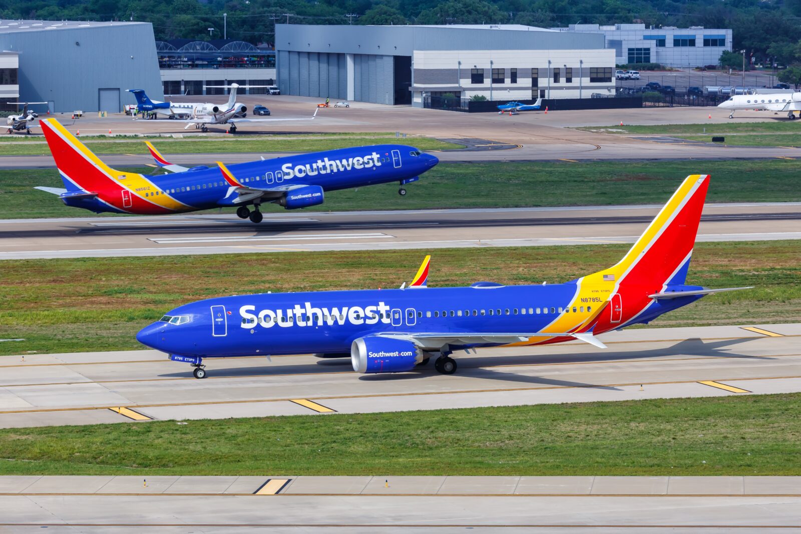 two airplanes on a runway