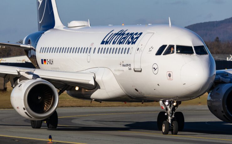 a white airplane on a runway