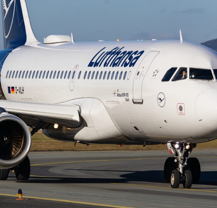 a white airplane on a runway