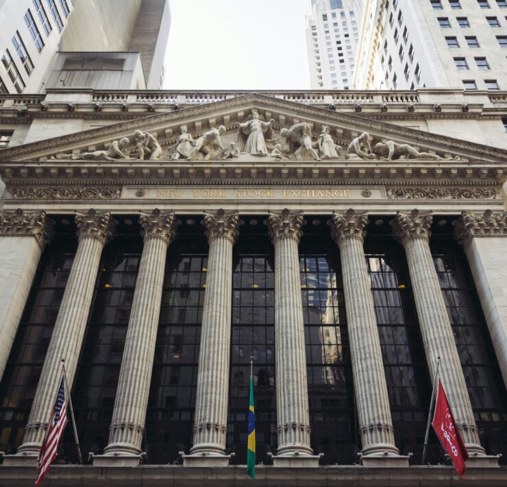 a building with columns and flags