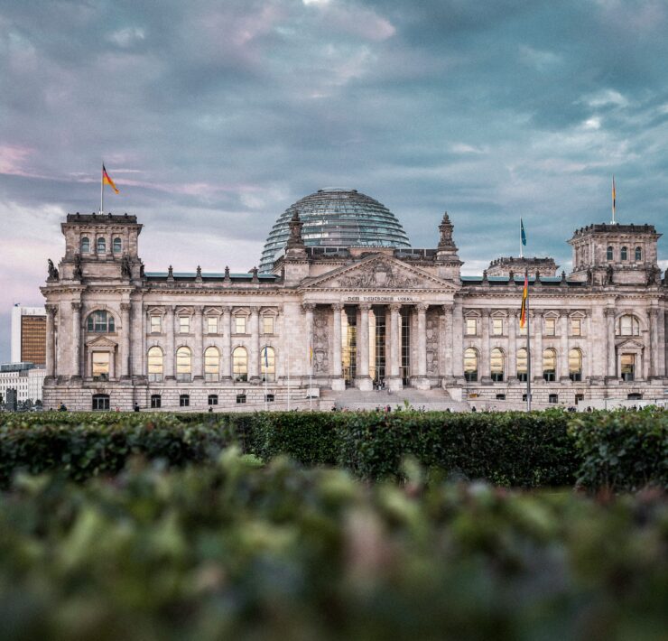a large building with a dome and a dome with Reichstag building in the background