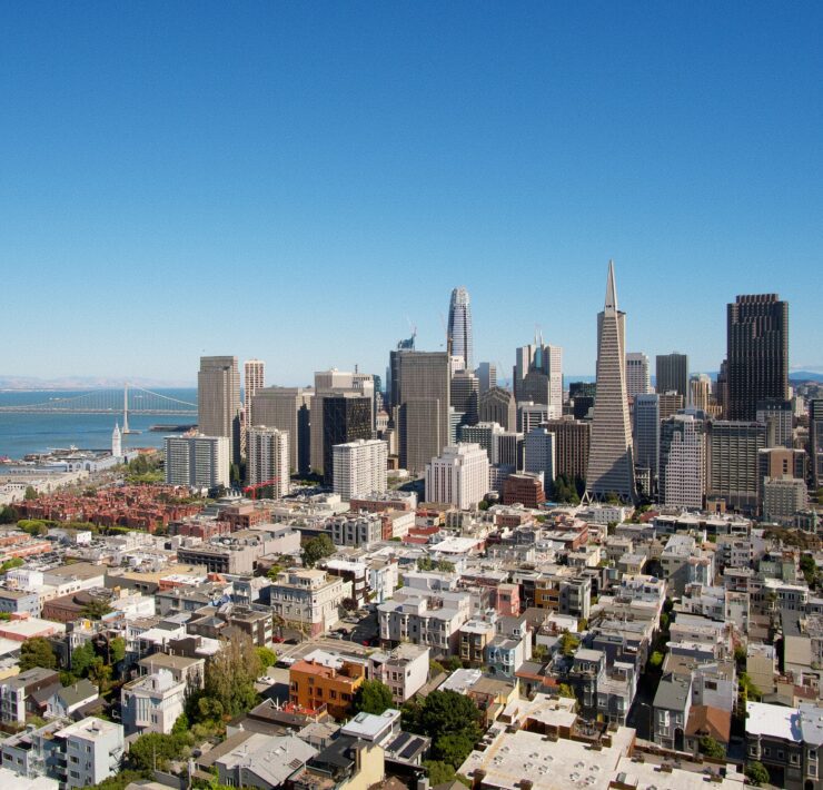 a city with many buildings and a body of water