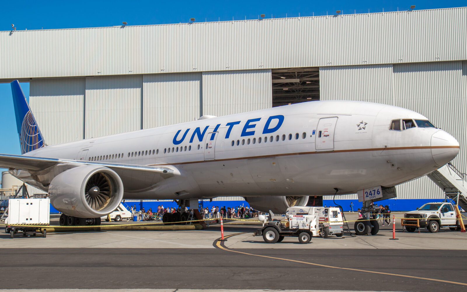 a large airplane parked in front of a building