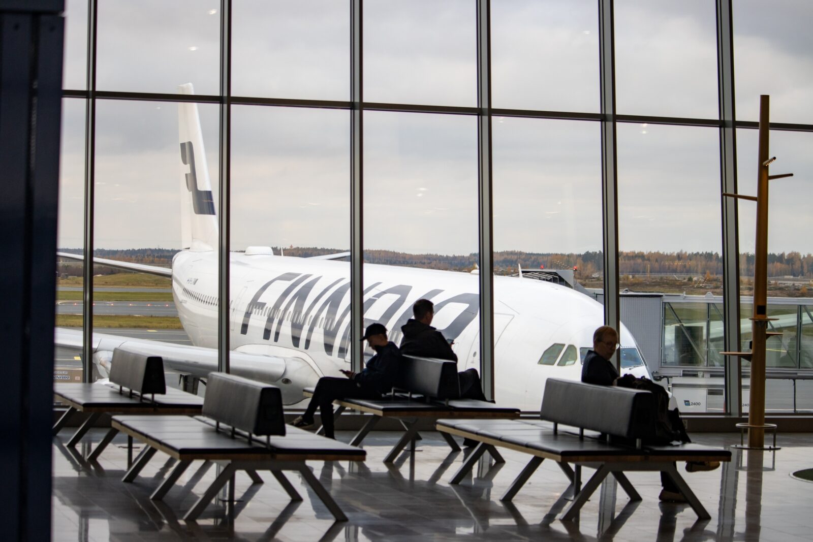 people sitting in a terminal waiting area