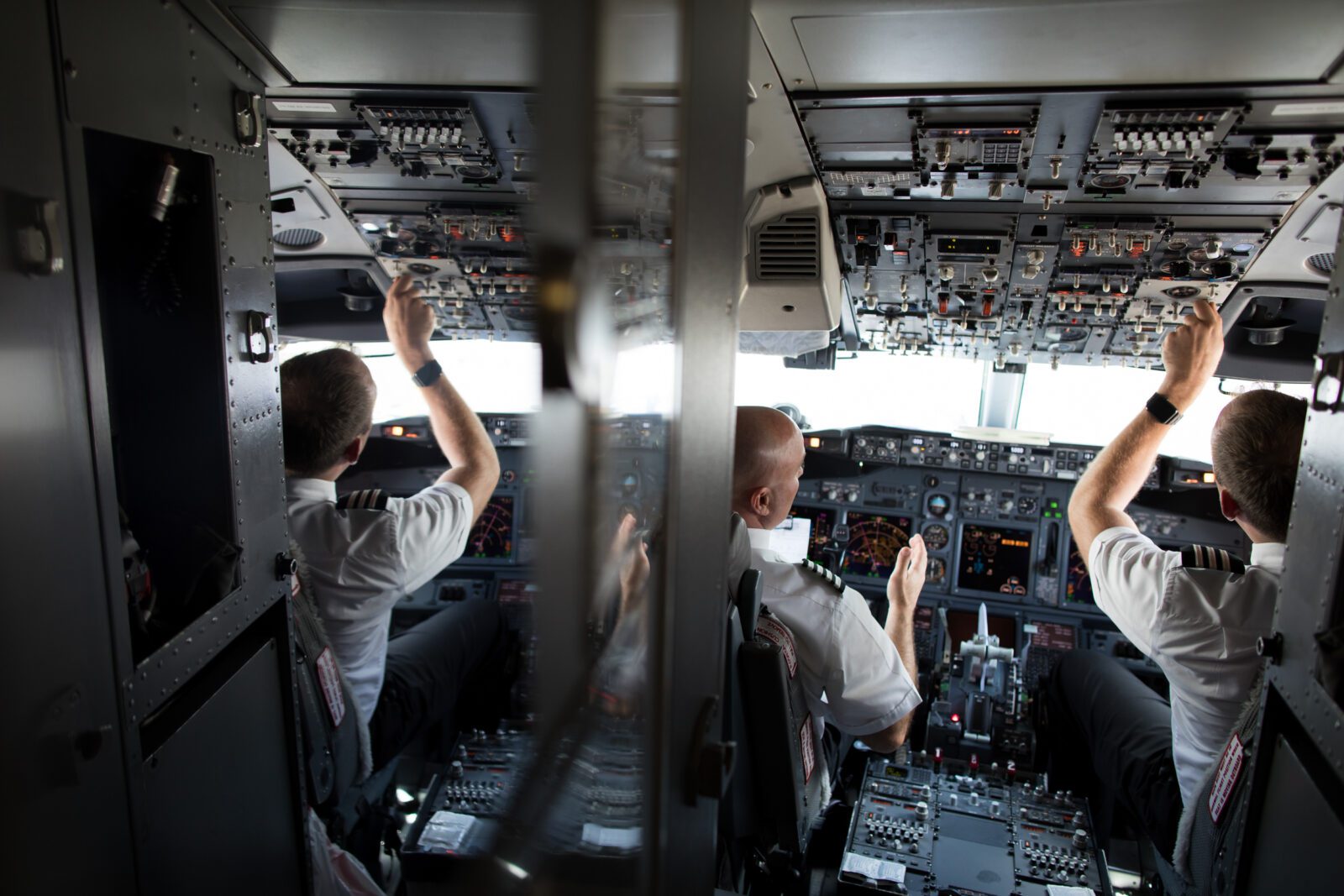 a group of men in a cockpit