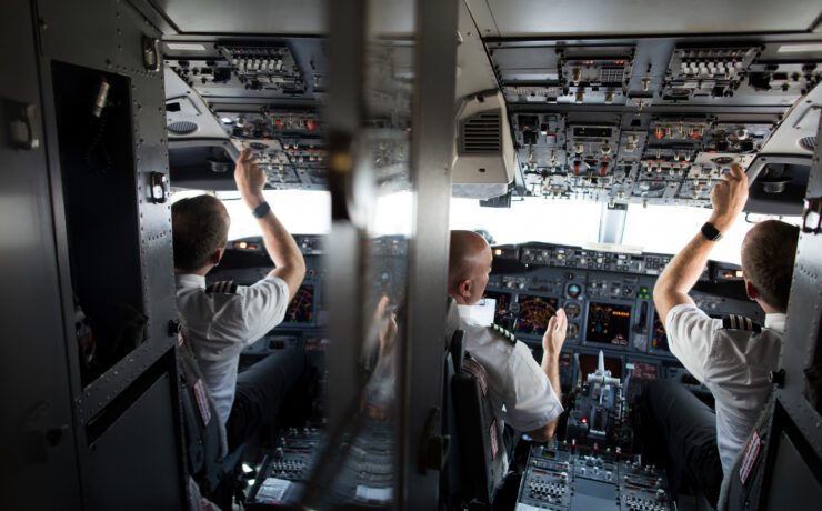 a group of men in a cockpit